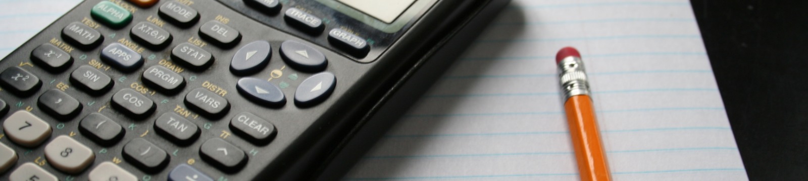 Picture of a calculator with a pencil and paper