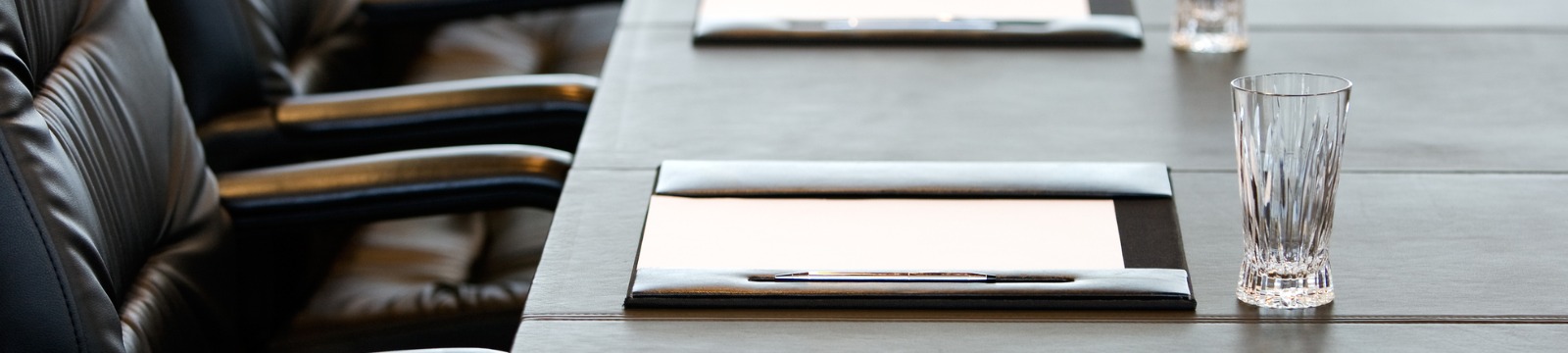 picture of board room table setup for a meeting